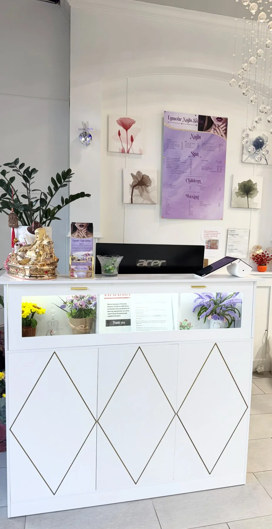 The reception desk welcoming guests to L’Amour Nail Spa